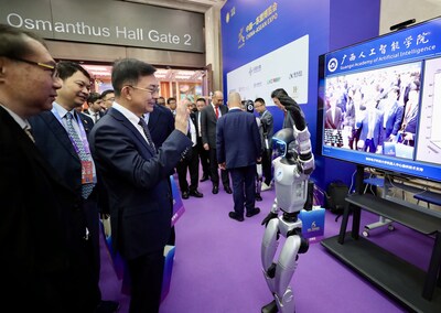 Participants interact with a humanoid robot at the 22nd China-ASEAN Expo.